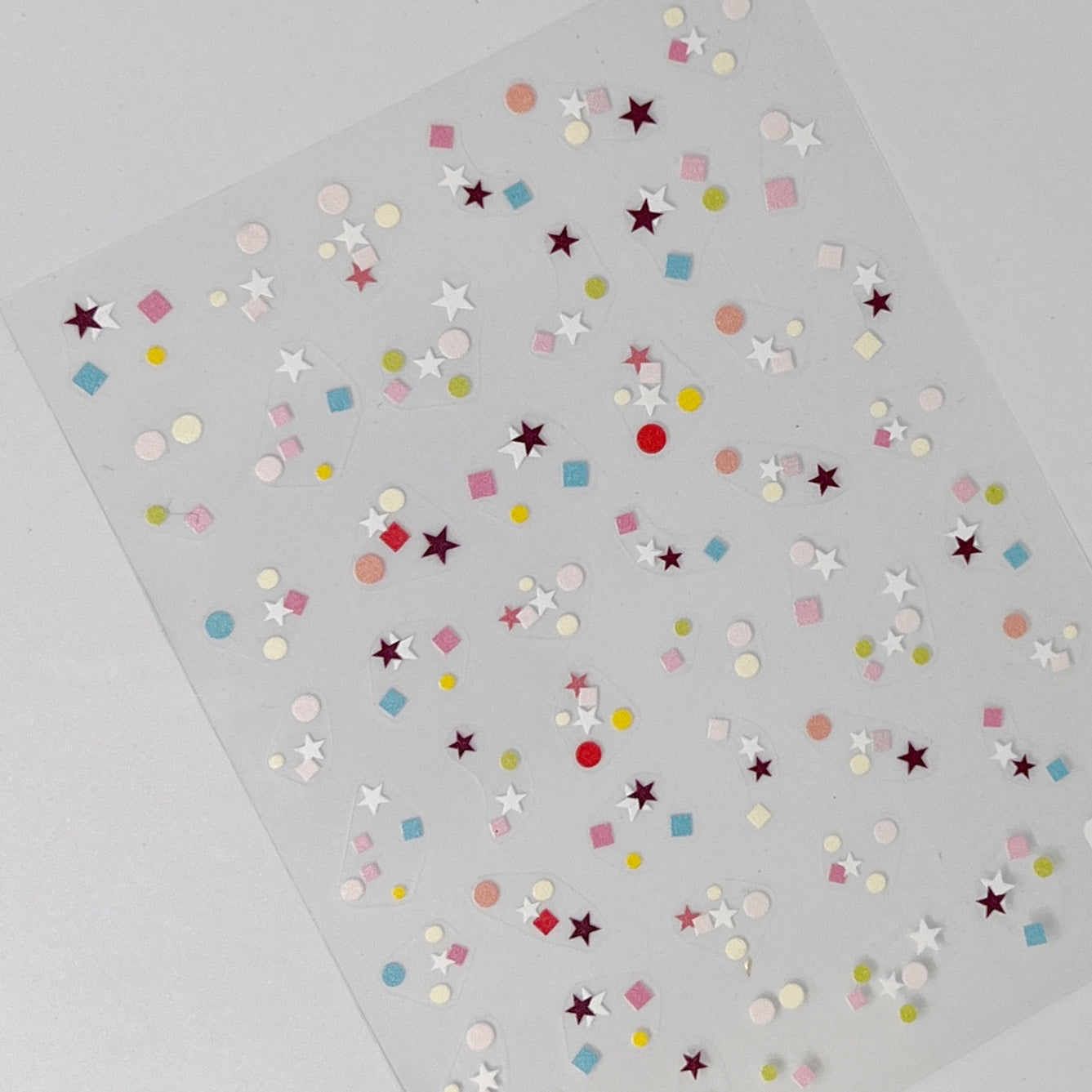 Terrazzo Confetti Nail Stickers - Flat Nail Stickers Featuring a Variety Multi-Color of Terrazzo-Inspired Shapes, Including Stars.