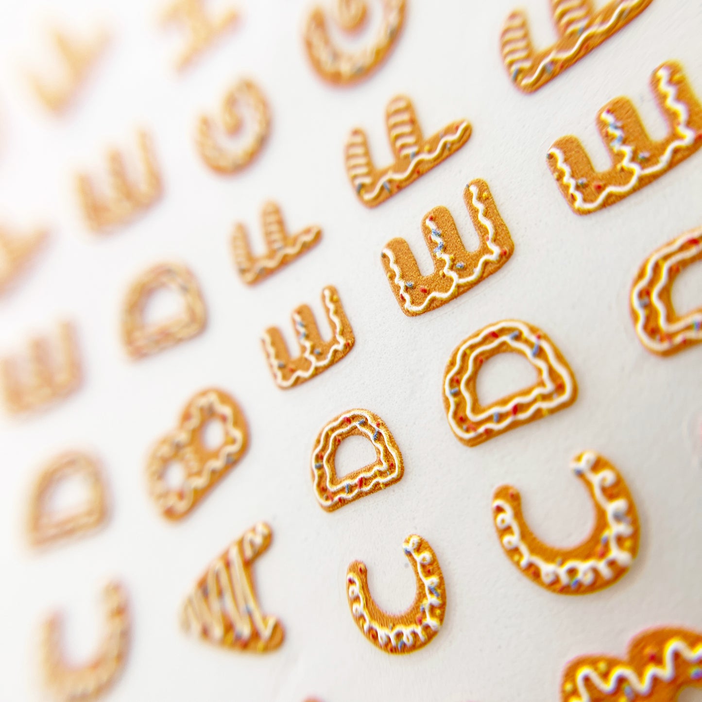 Gingerbread Letters Nail Stickers - Gingerbread Cookie-Inspired Alphabet Letters, Displayed on a White Background.