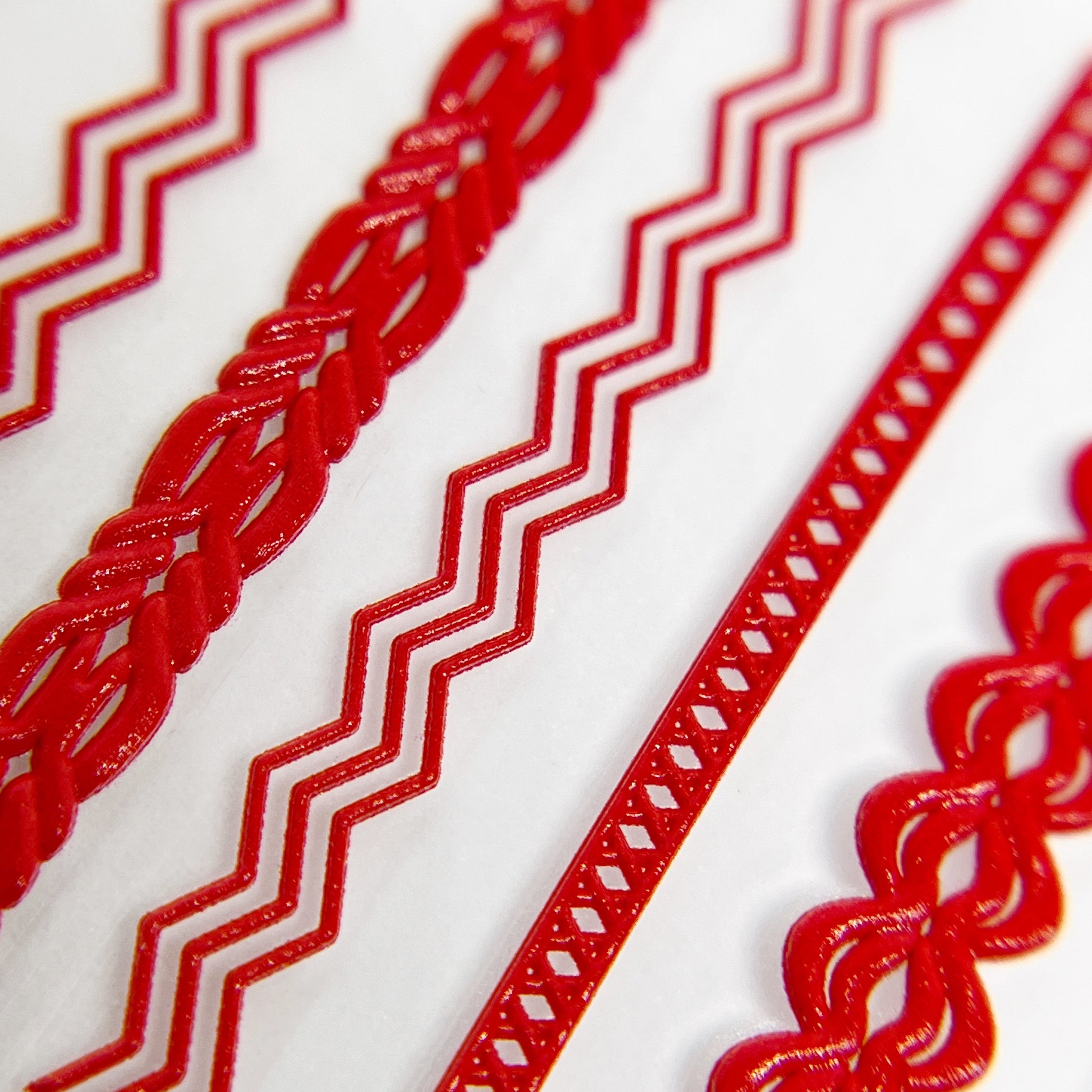 Close-Up of Textured Trim Nail Stickers in Red - Detailed View of Raised Texture Nail Stickers with Fabric Trim-Inspired Design.