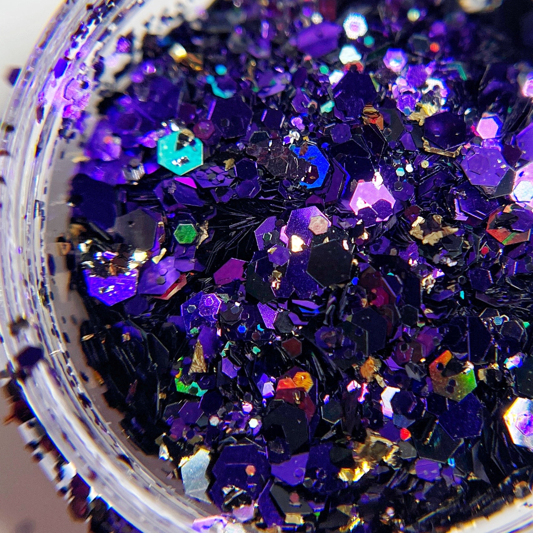 Purple glitter mix in clear jar. 