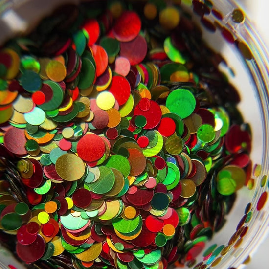 Video of circle glitter in clear jar on white background.