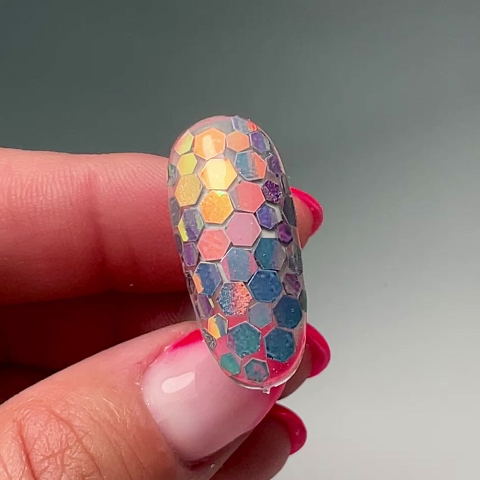 video of hand holding decorated nail tip