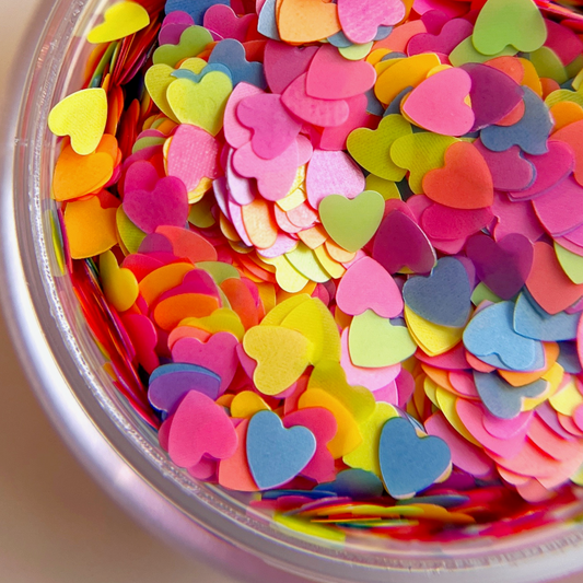 Multicolor heart shaped glitter in clear jar. 