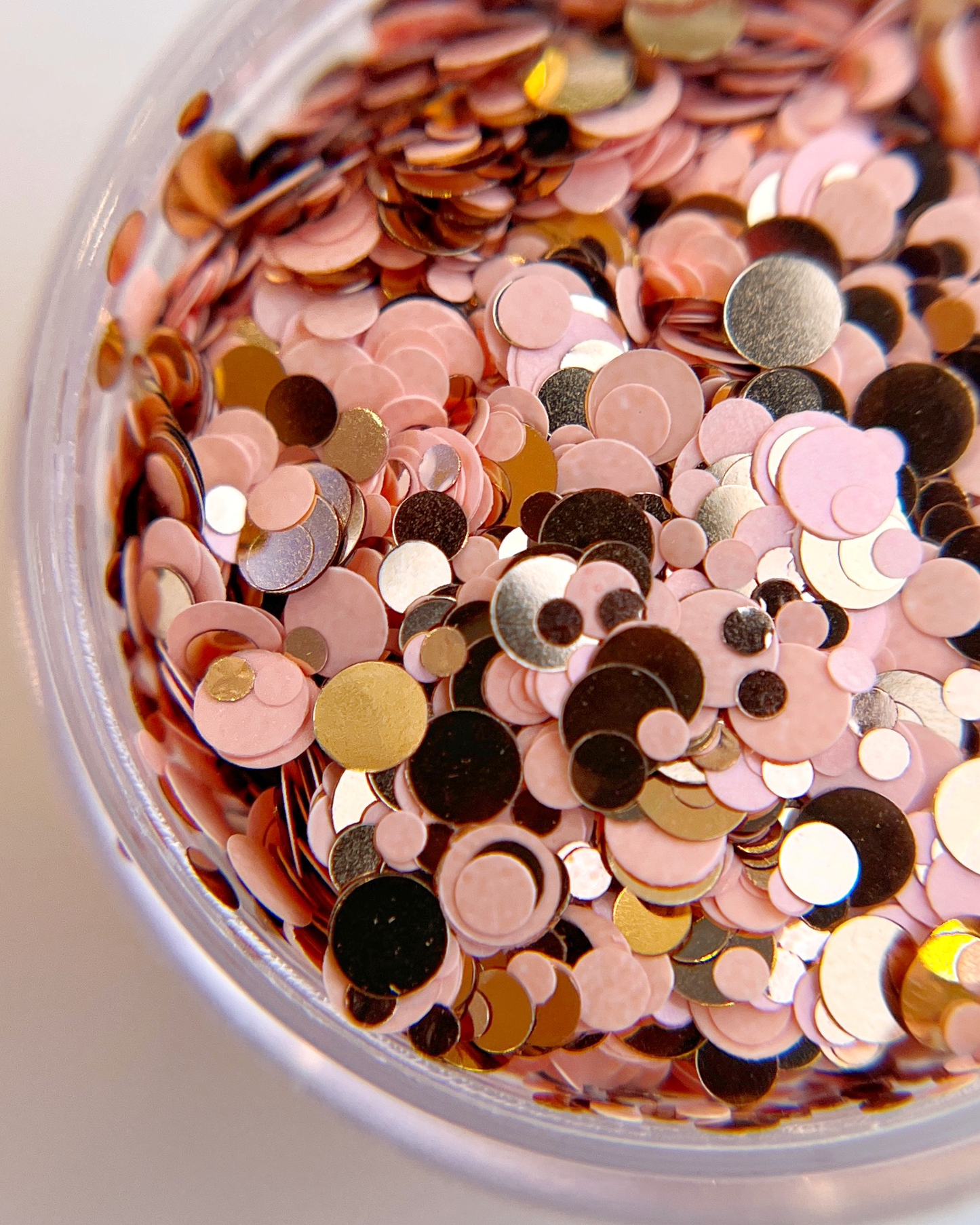 Close up of glitter mix in clear jar. 