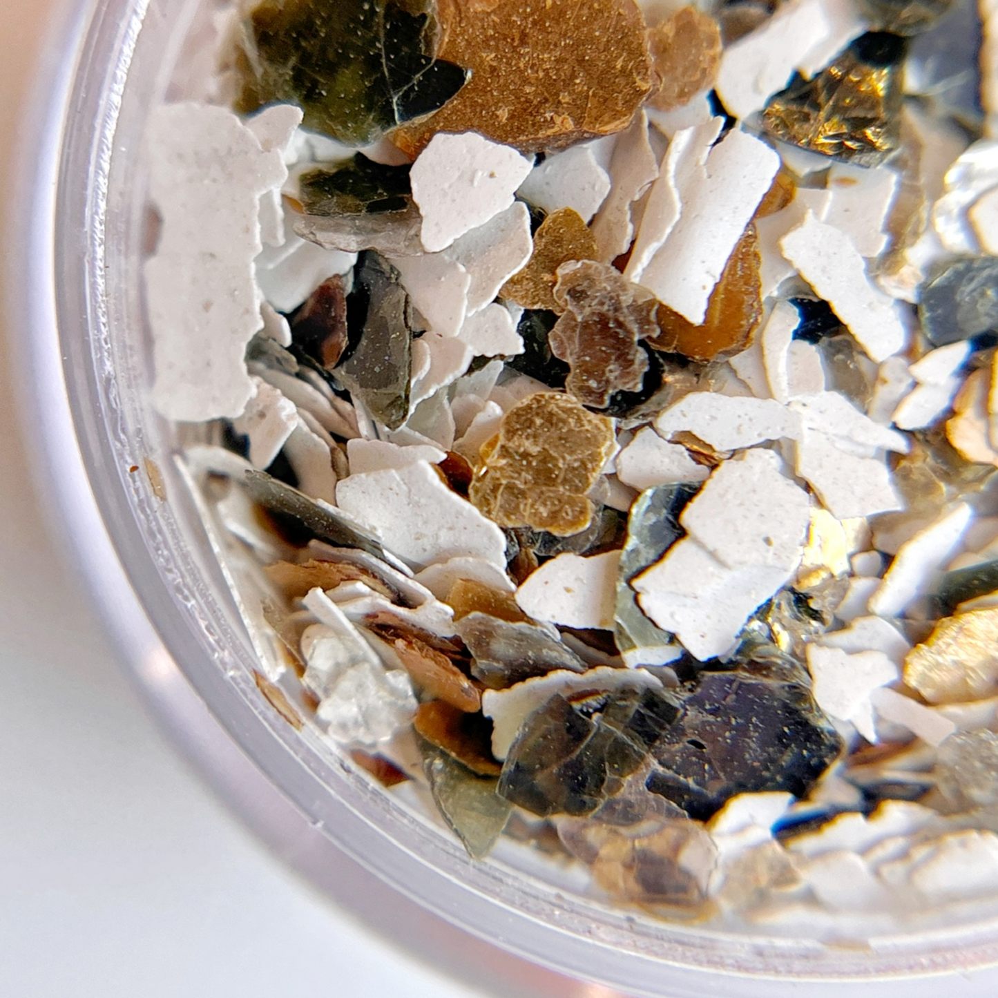 Multi-colored mica flakes for creating terrazzo style nail art. 
